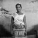 Ever Young Studio 1953-1959 Portrait of woman wearing Kente cloth and a banner that reads Miss Accra at Ever Young Studio. 